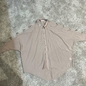 Womens blouse with peek arm holes